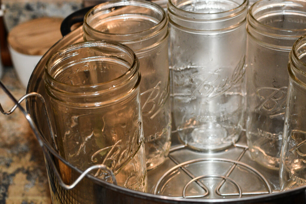 pictures of jars in a hot water bath canner